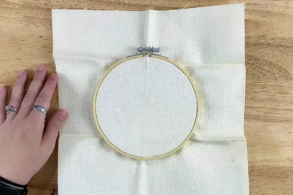 fabric in a screw tension embroidery hoop